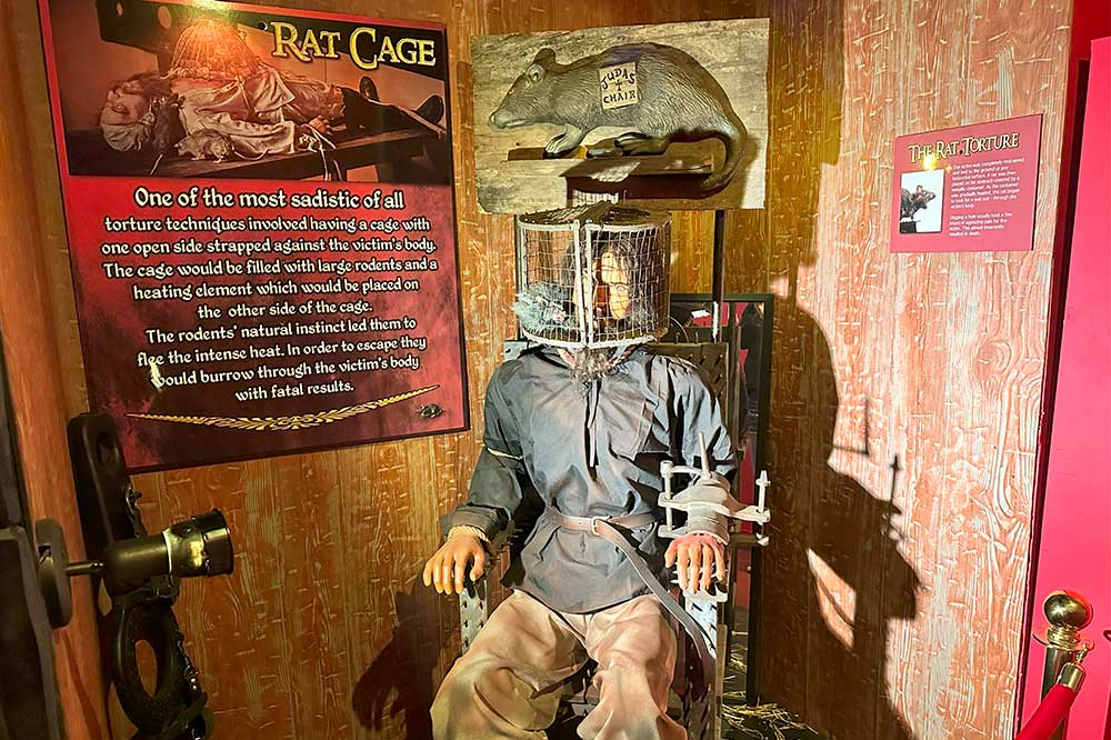 Assortment of medieval torture devices on display, including iron restraints and brutal instruments from the museum’s Crime & Punishment exhibit