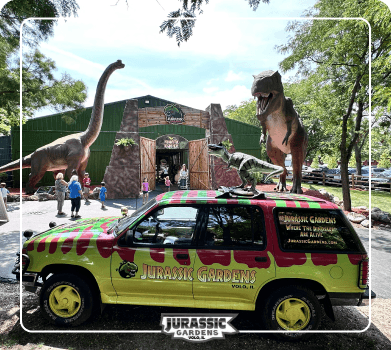 Jurassic Gardens dinosaur exhibit background with life-size roaring dinosaurs and prehistoric foliage at Jurassic Gardens at Volo Museum in Illinois