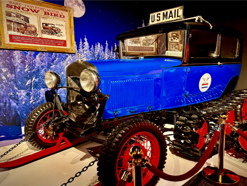 Vintage blue postal vehicle on display