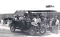 Vintage car with people gathered