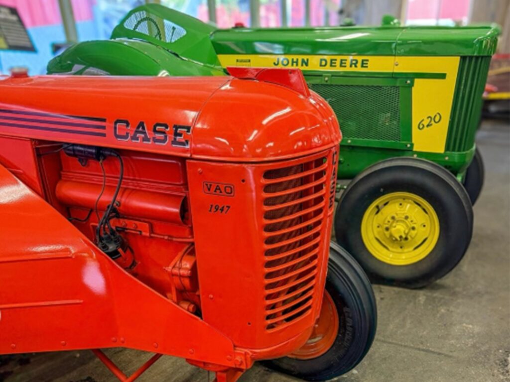 Two vintage tractors in display