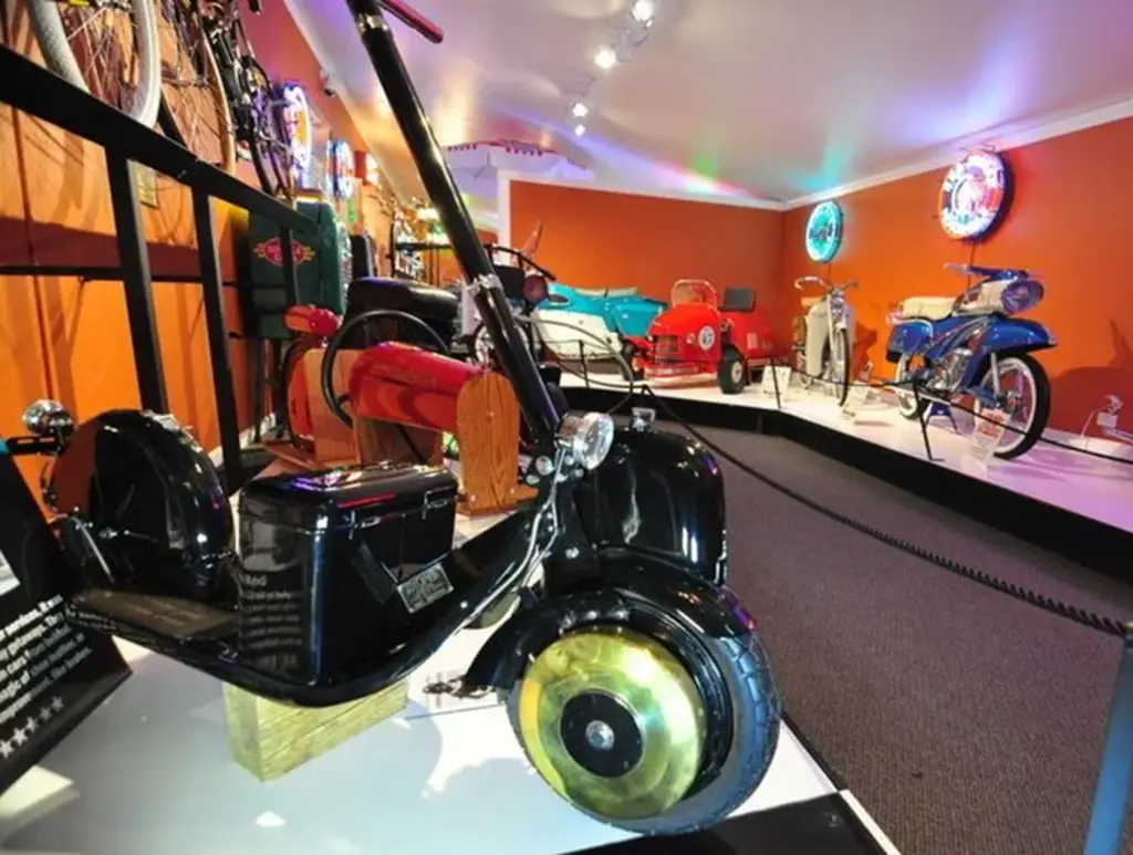 Vintage vehicles displayed in a museum