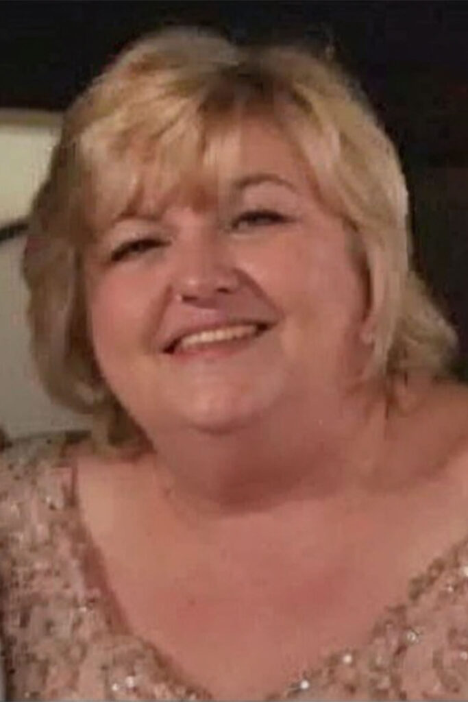 Woman in sparkly dress smiling