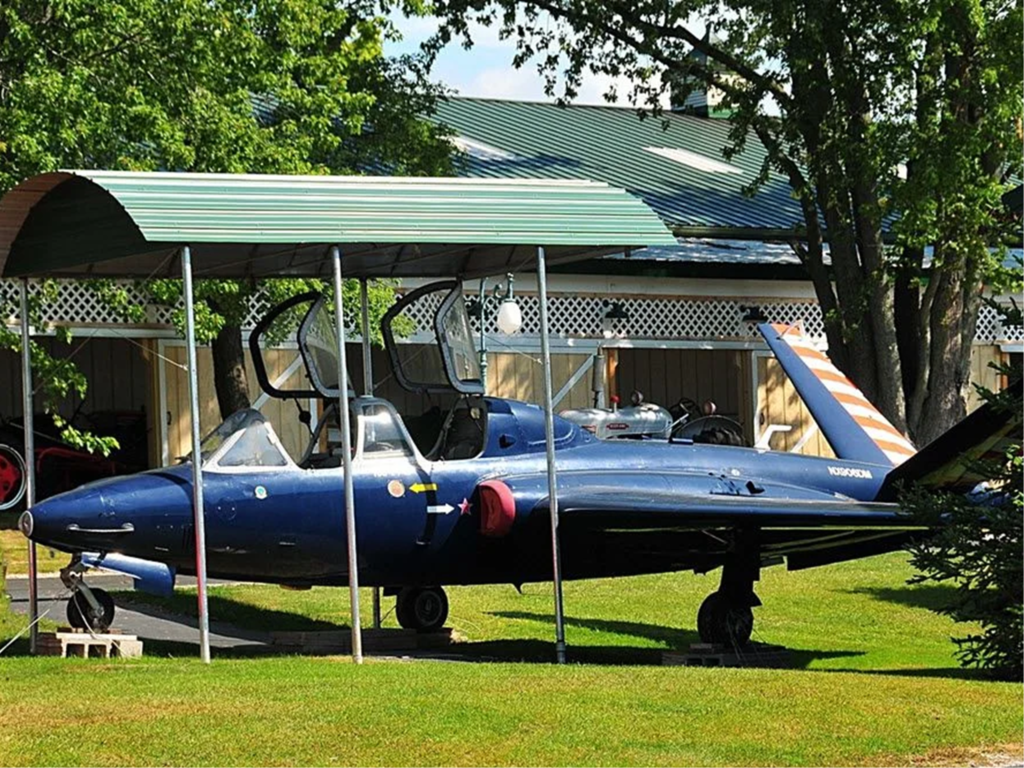 Blue aircraft under a shelter