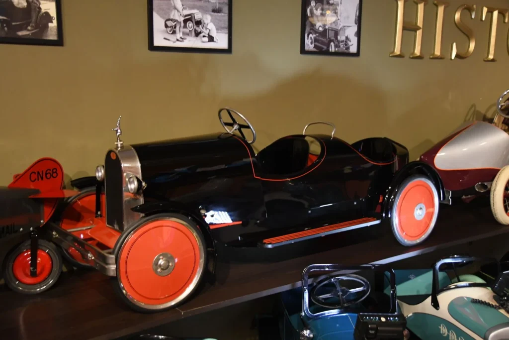 Vintage toy car display on shelf