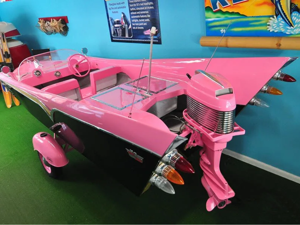 Pink vintage car with boat features