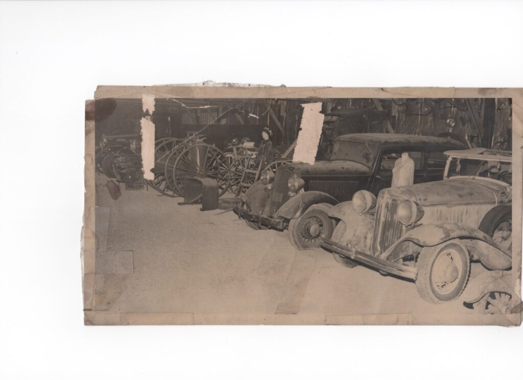 Old cars in a dusty garage