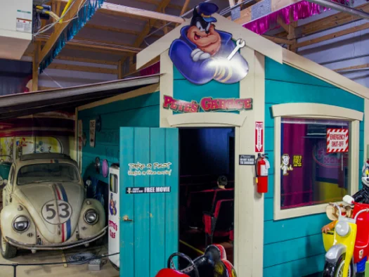 Colorful garage with vintage car
