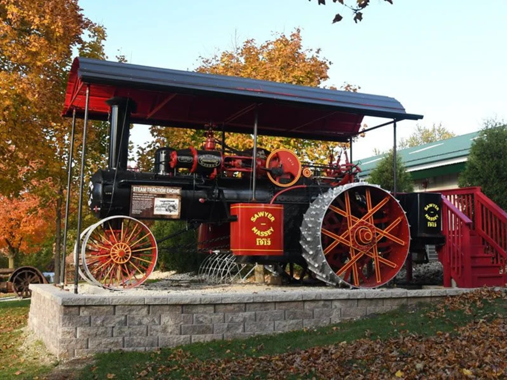 Vintage steam tractor under shelter