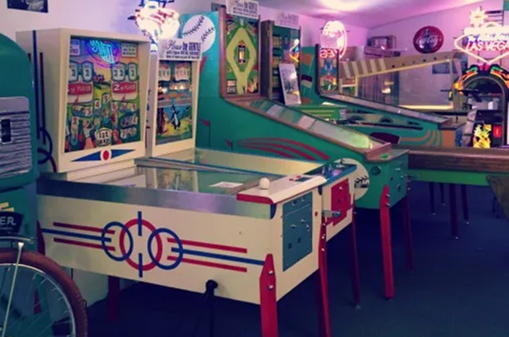 Colorful vintage pinball machines displayed indoors