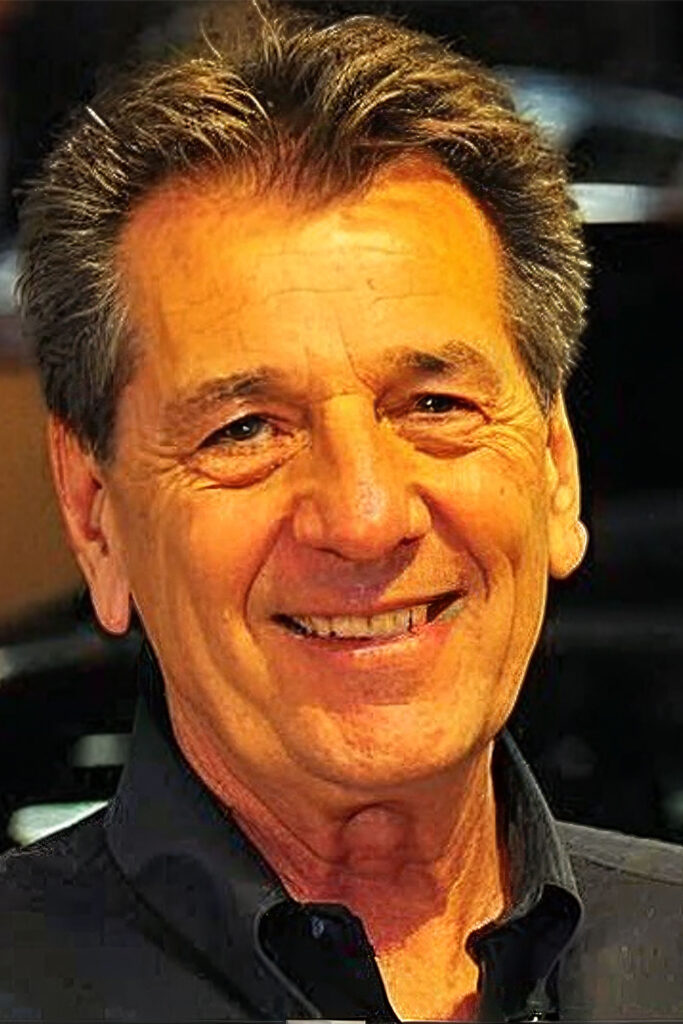 Person with dark hair, wearing shirt.