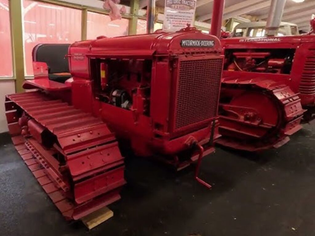 Red vintage tractors in display