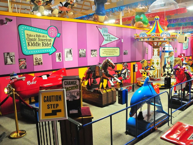 Vintage kiddie rides in colorful arcade