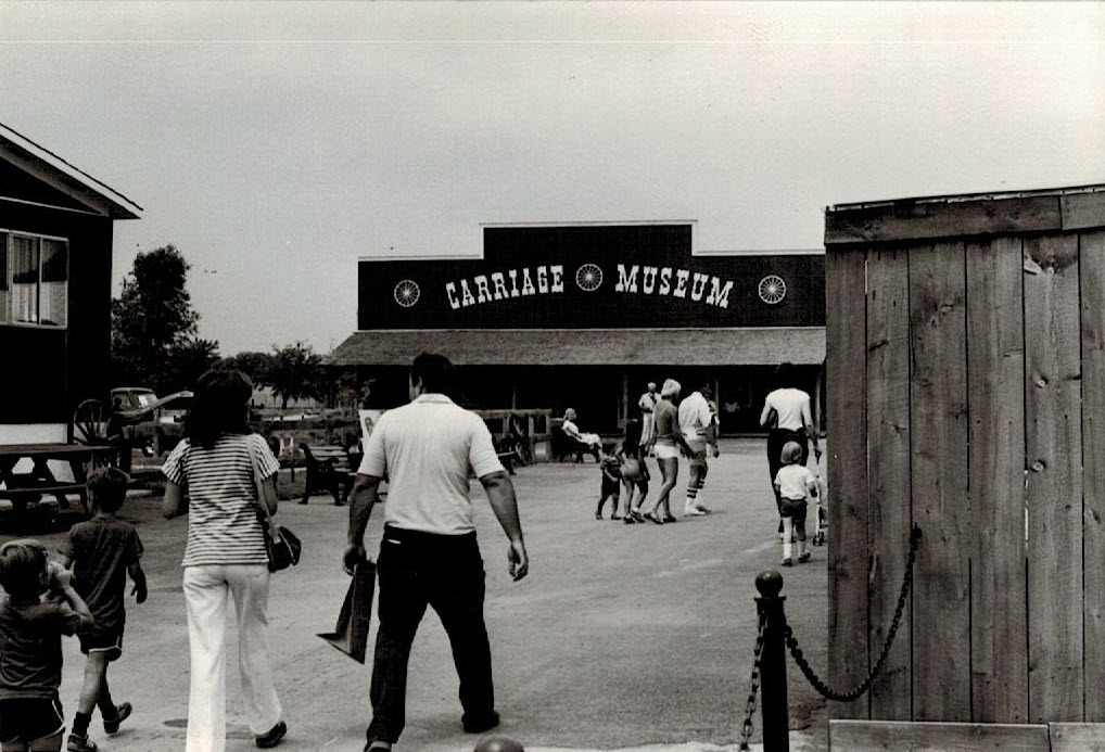 Visitors entering Carriage Museum outdoors