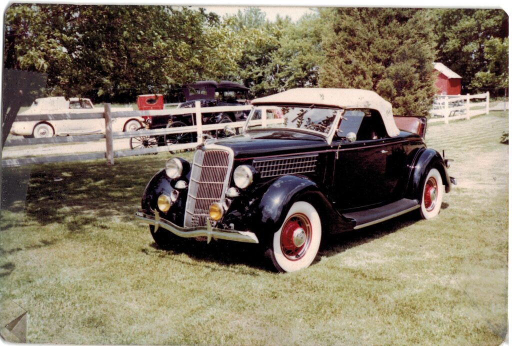 Classic convertible car on grass