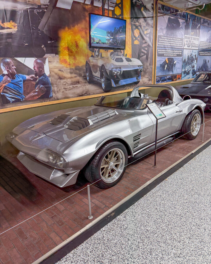 Silver sports car displayed in museum