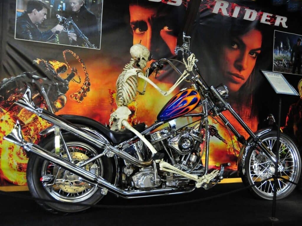 Skeleton riding a colorful ghostrider motorcycle