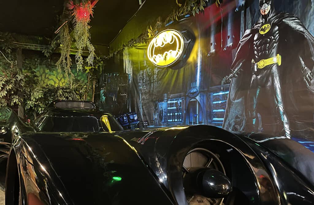 Batmobile with Batman mural backdrop