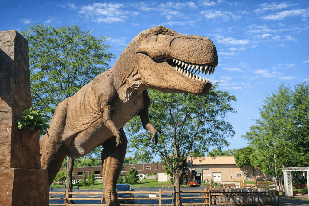 Large dinosaur statue in outdoor setting
