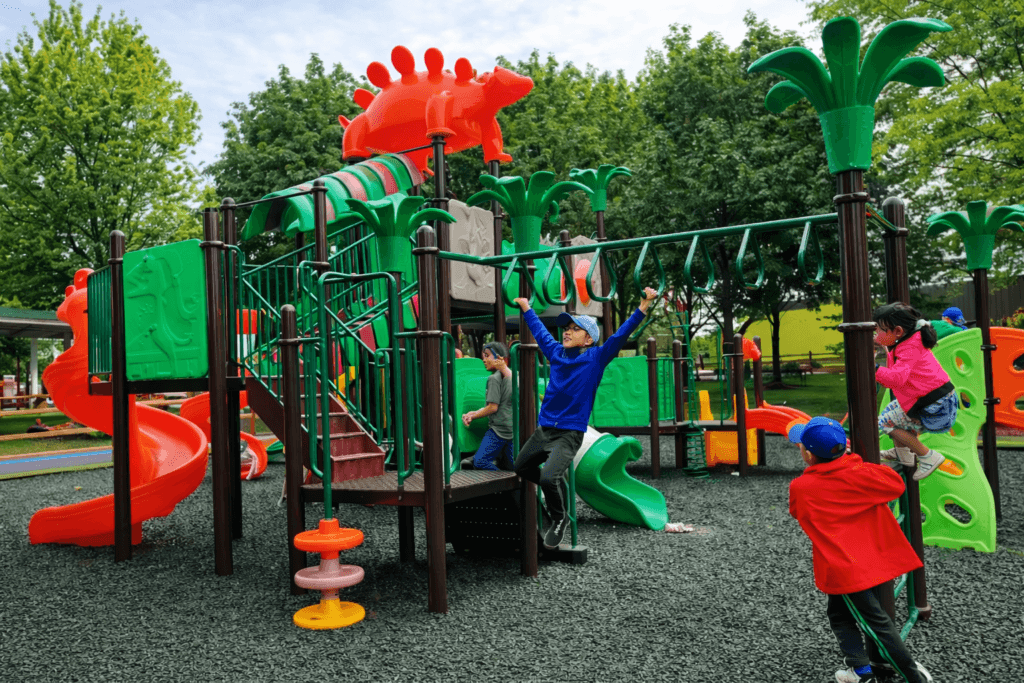 Children playing on colorful playground equipment