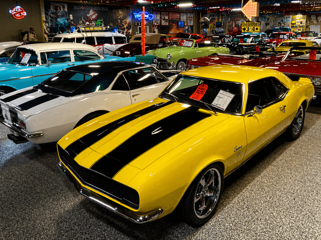 Classic cars in vibrant showroom setting
