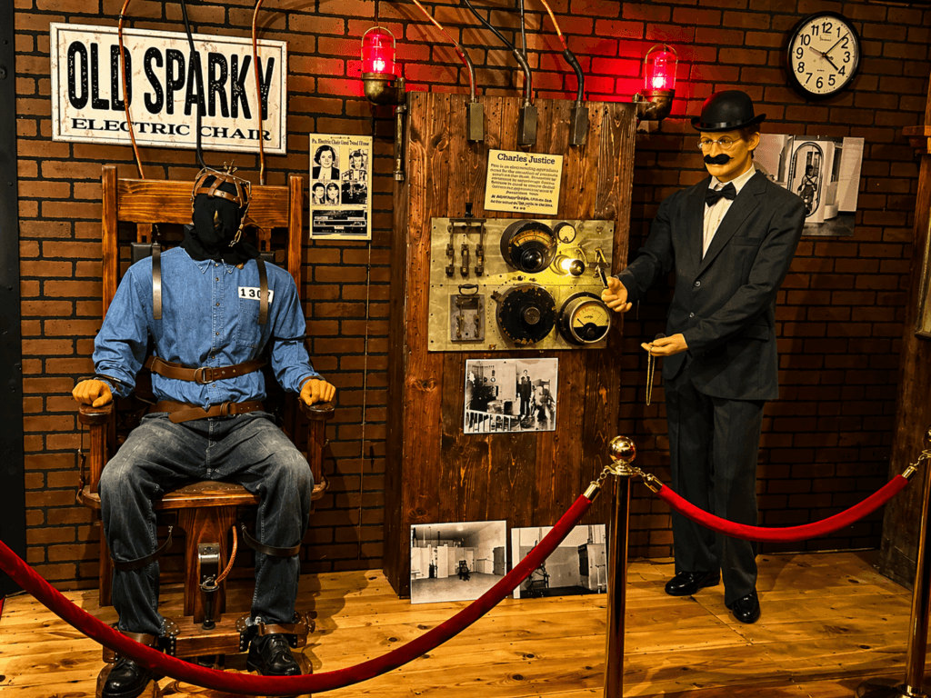Electric chair exhibit with mannequin figures