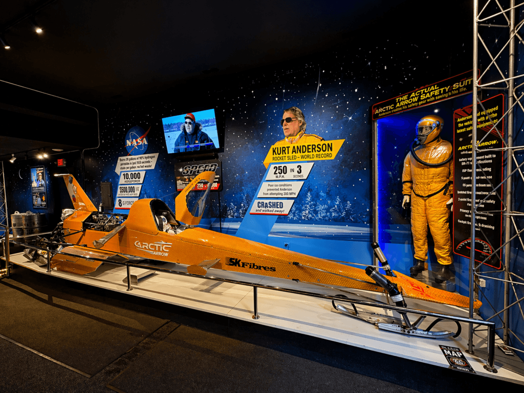 Orange race sled with astronaut display