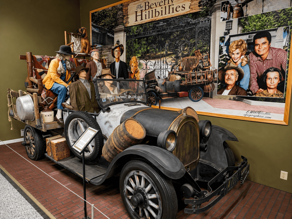 Vintage car with Beverley hillbilly figures