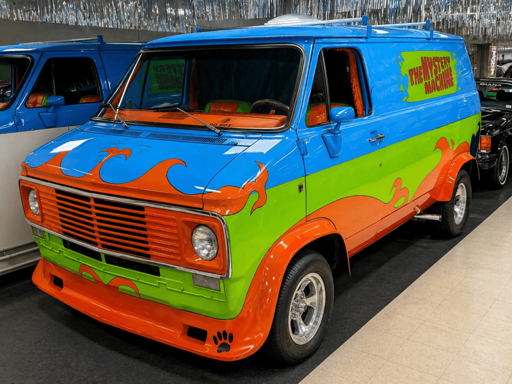 Colorful van with flame design.