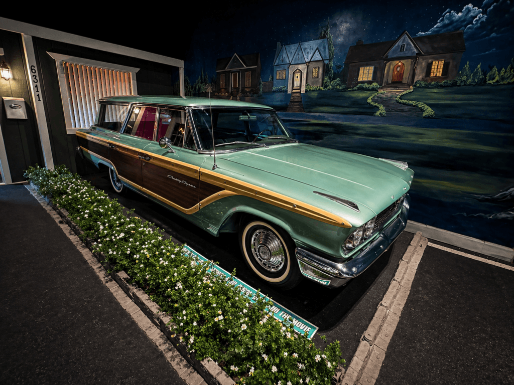 Vintage car with wood paneling from ford vs ferrari and the fablemans