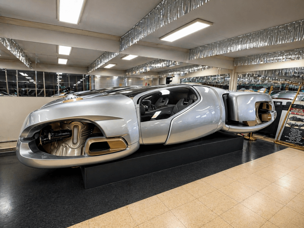 Futuristic car model on display.