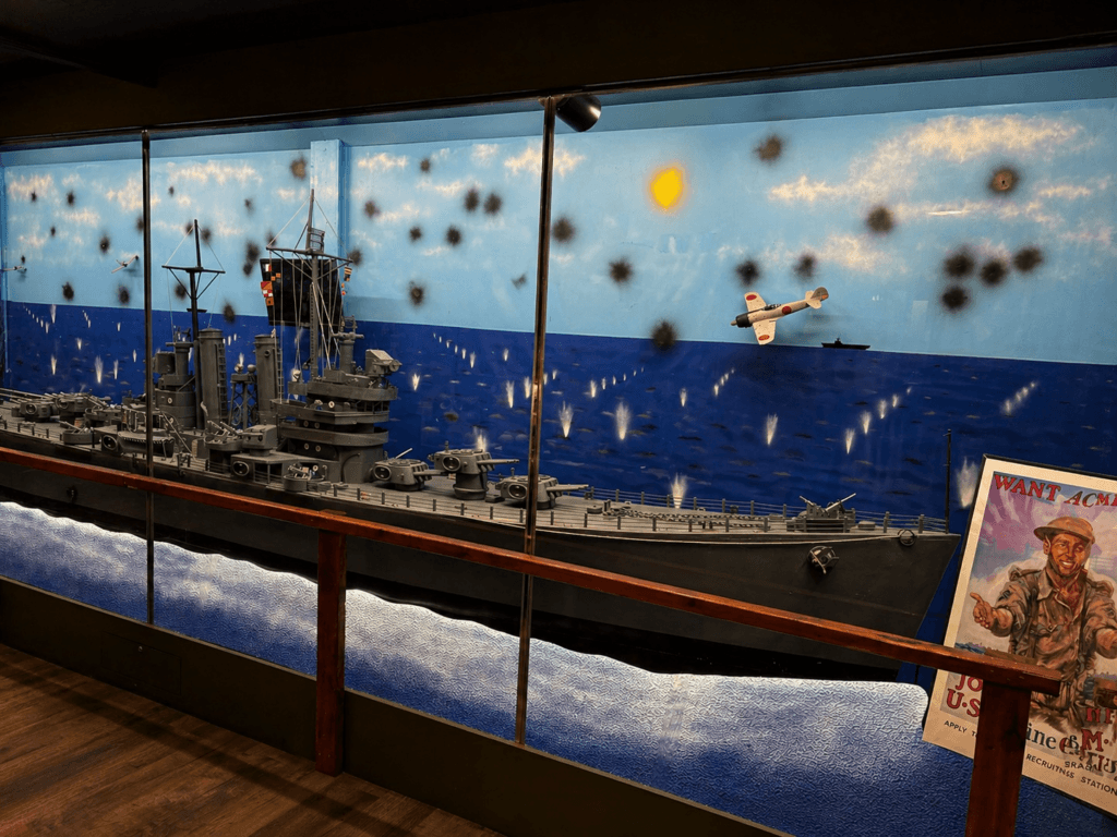 Naval battle diorama with aircraft.