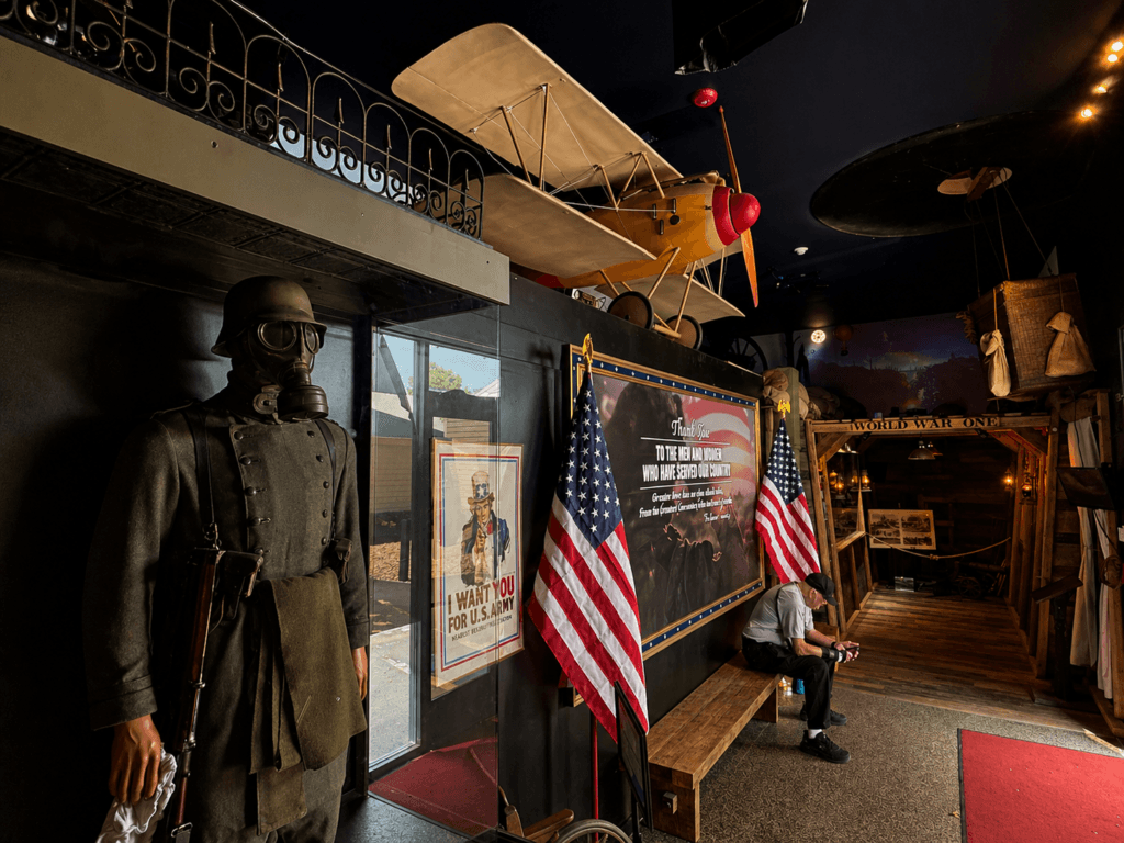 Historical exhibit with vintage airplane and uniforms