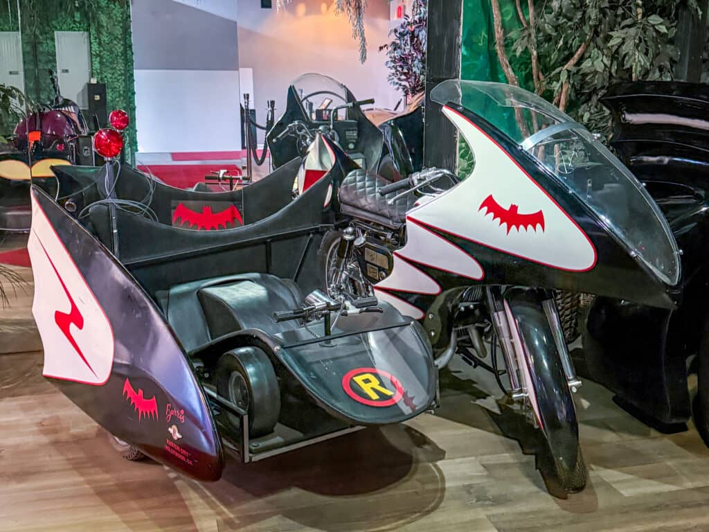 Batcycle with sidecar, red accents.