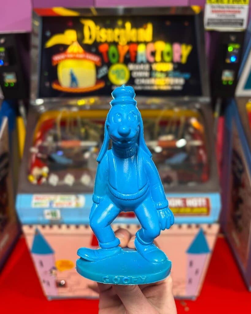 Old arcade machine with colorful controls micromold machine