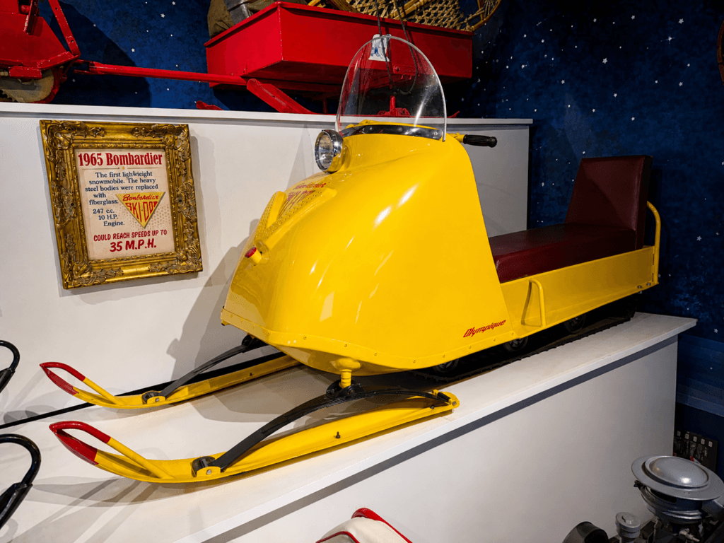 Yellow vintage snowmobile on display