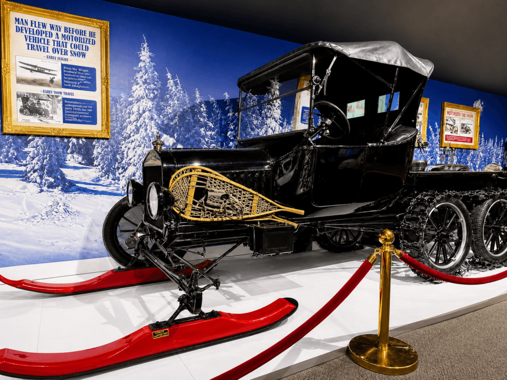 Vintage car with snowmobile attachments