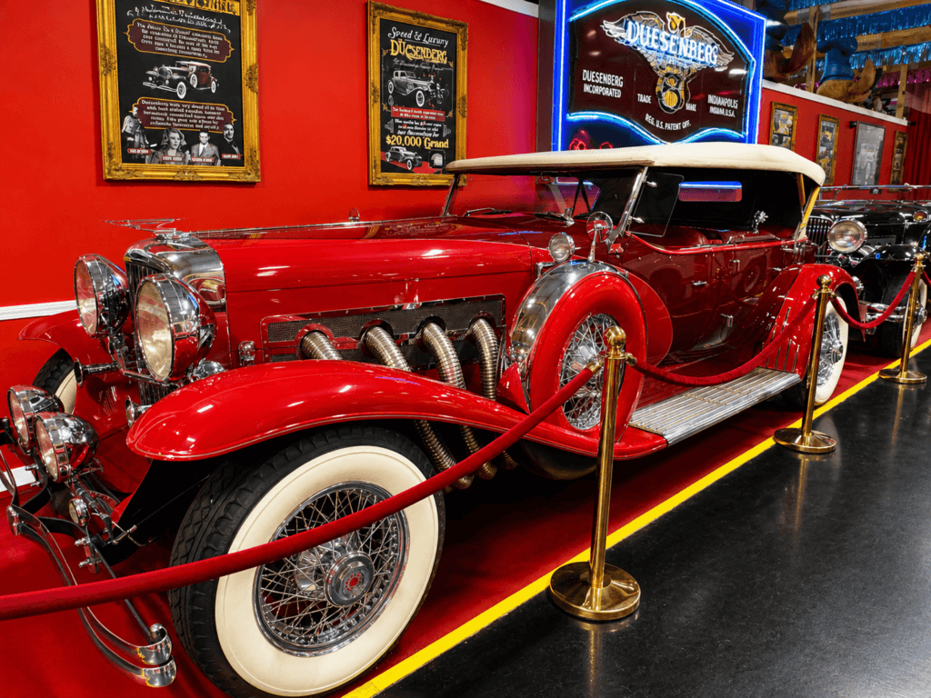 Vintage red duesenberg luxury car display