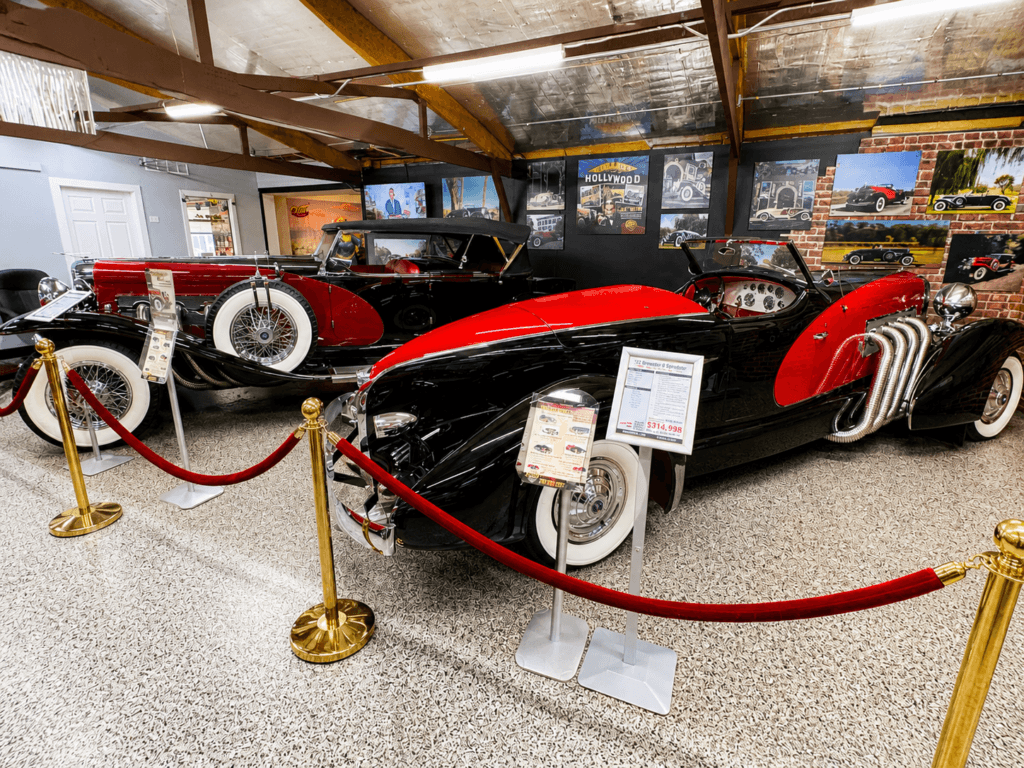 Classic duesenberg cars in a museum setting