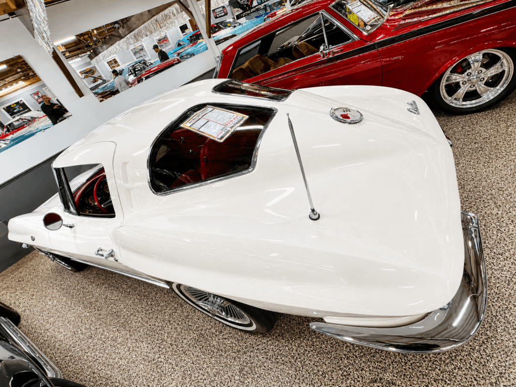 Classic white corvette in showroom