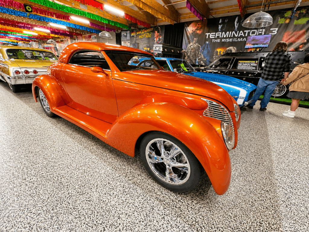 Shiny orange vintage car in showroom