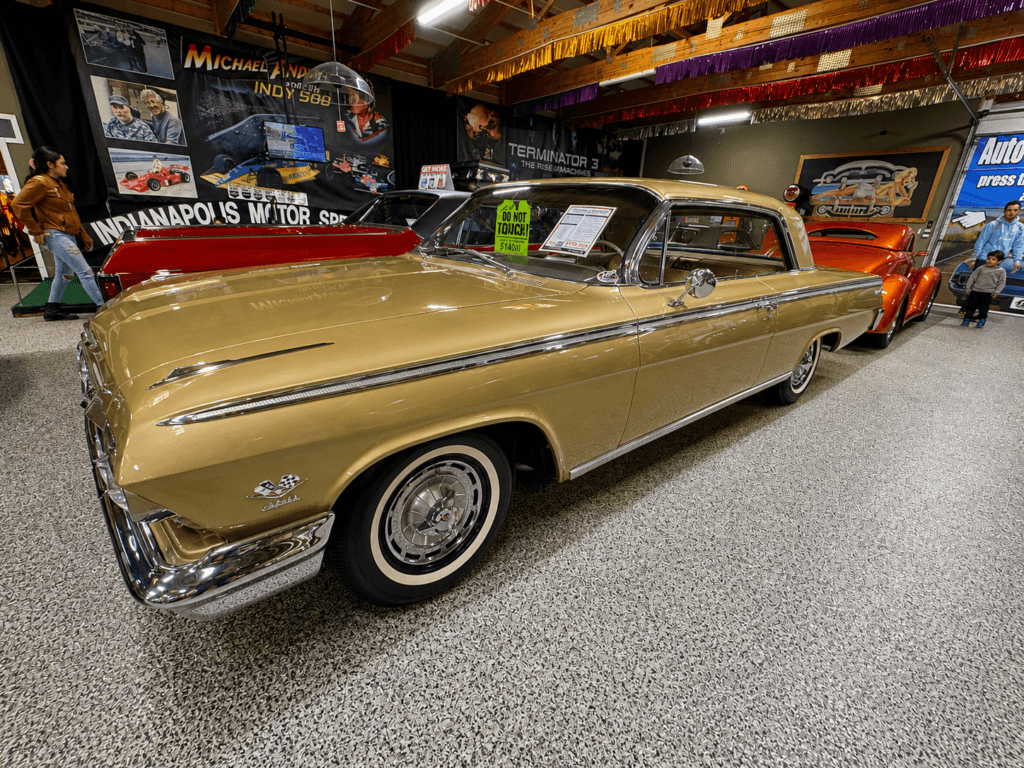 Classic gold car in a museum