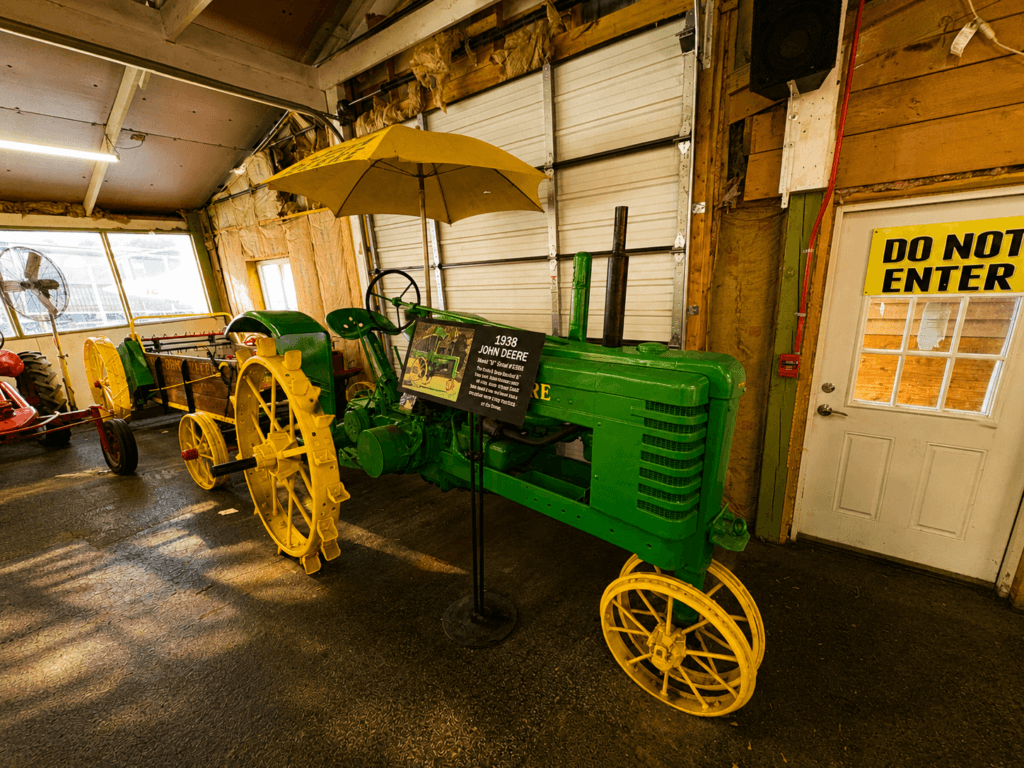 Vintage tractors in a barn setting.