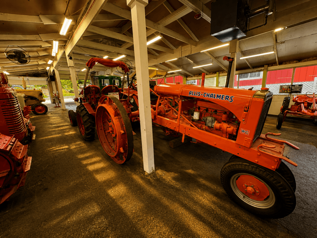 Vintage tractors in a barn setting.