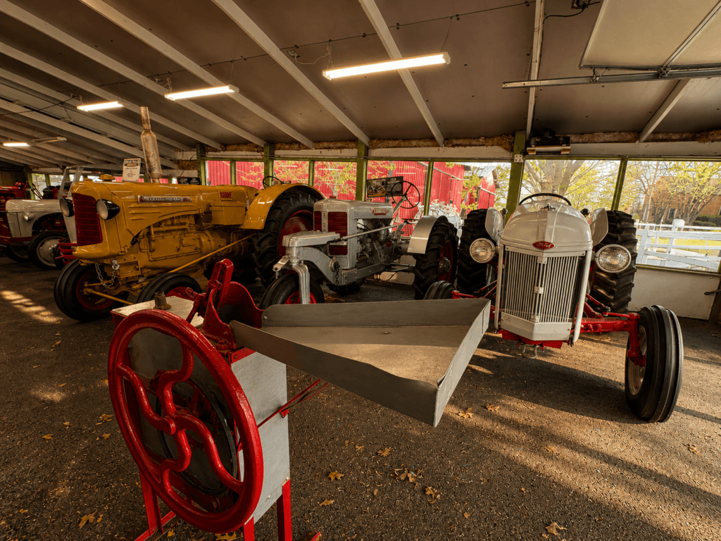 Vintage tractors in a barn.