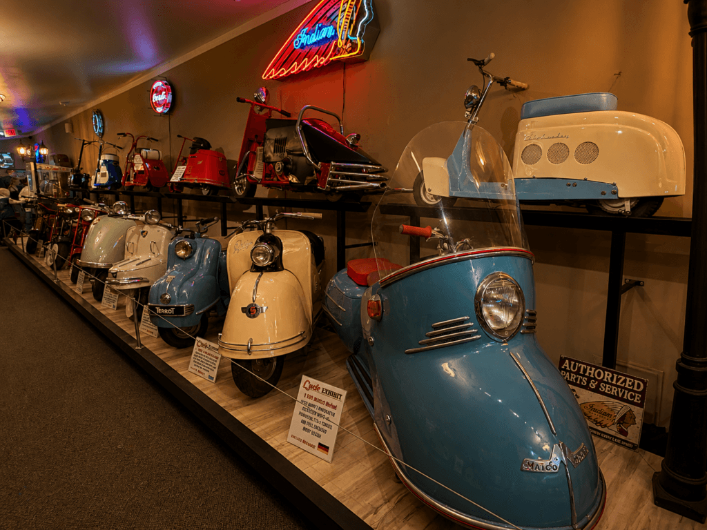 Vintage scooters displayed in a museum