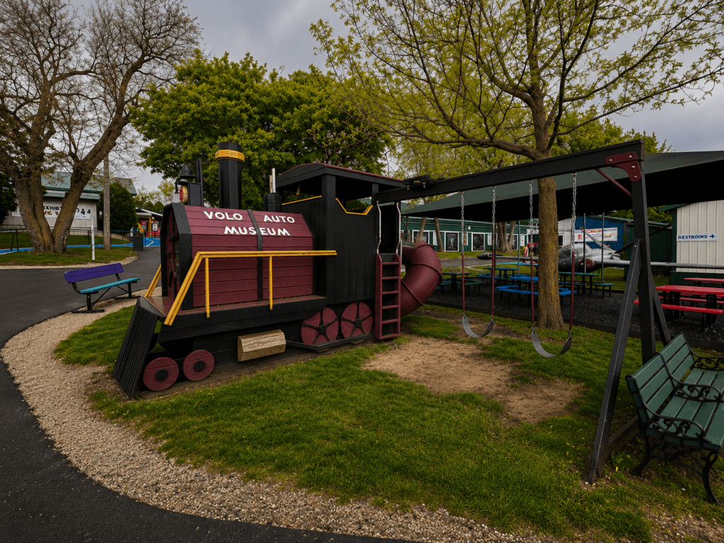 Playground train structure with swings.