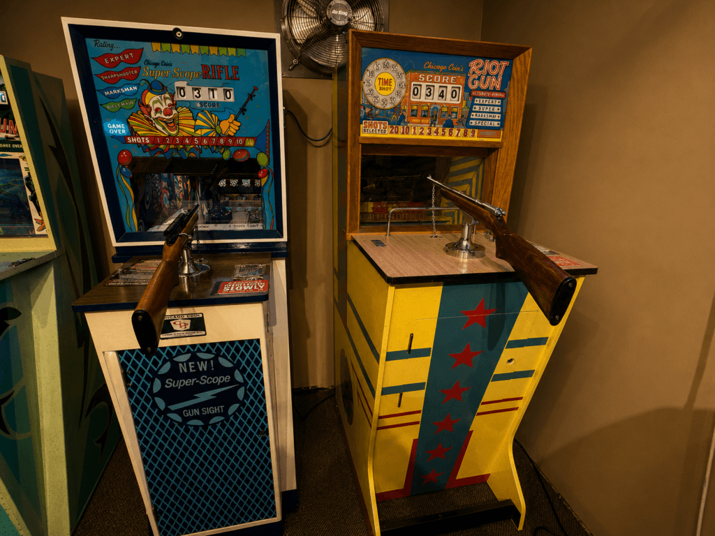 Two vintage shooting arcade games.