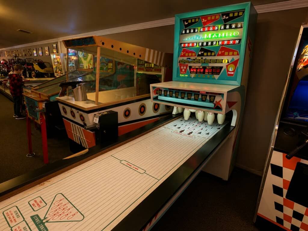 Vintage arcade bowling game setup.