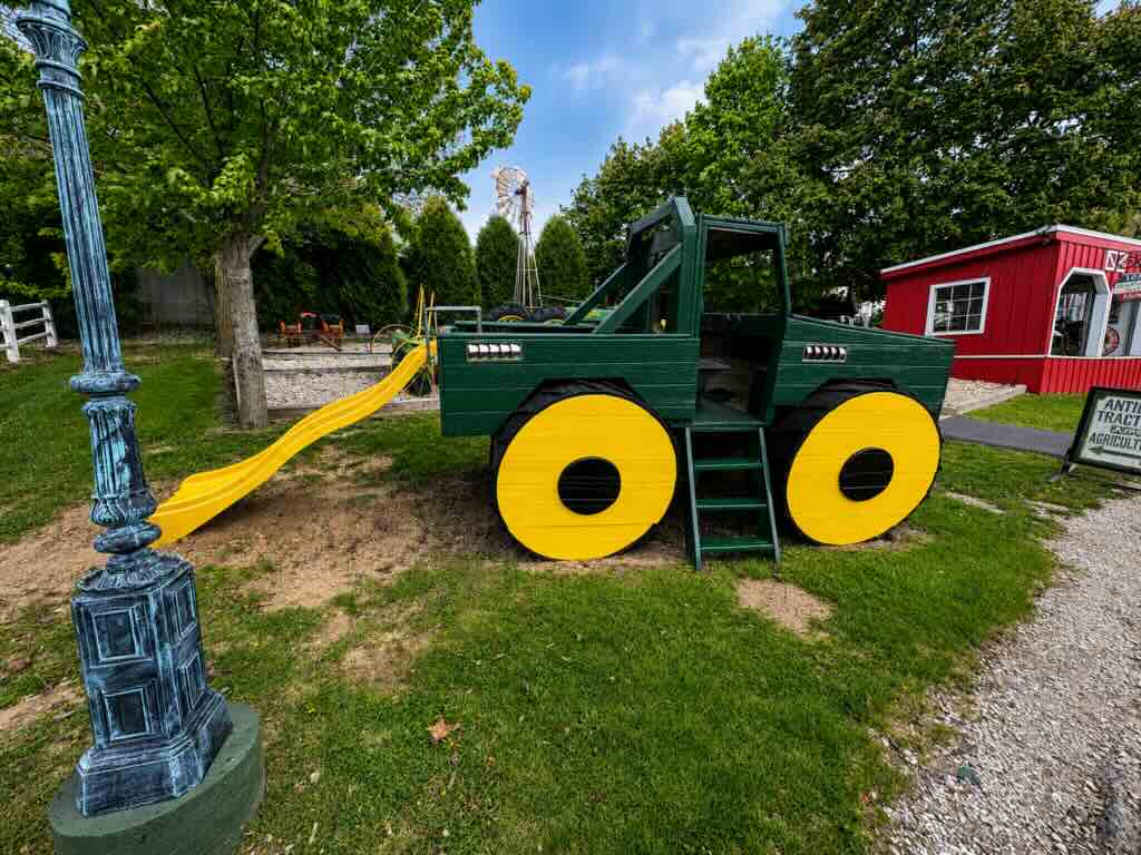 Playground slide shaped like tractor